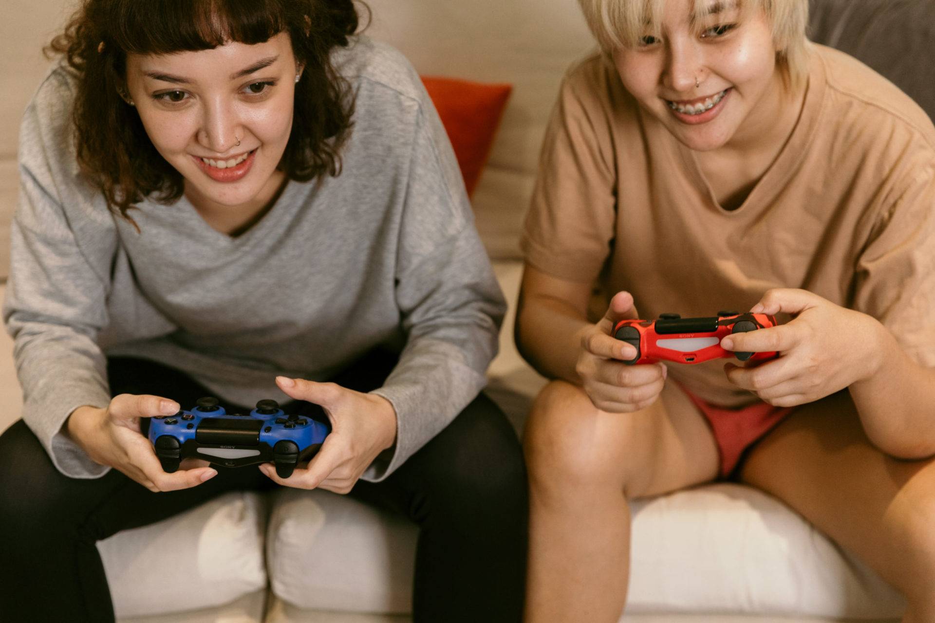 an image of two games playing using PlayStation controllers